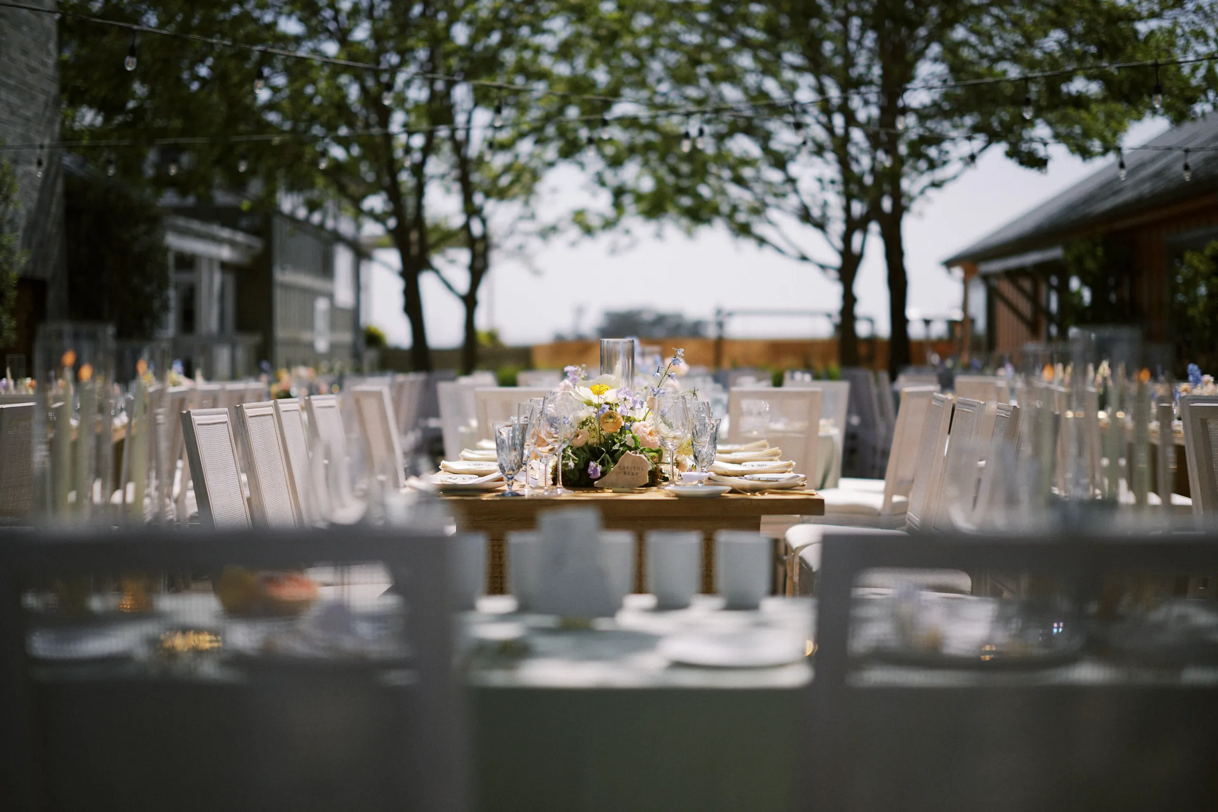 Reception tables laid out under the trees